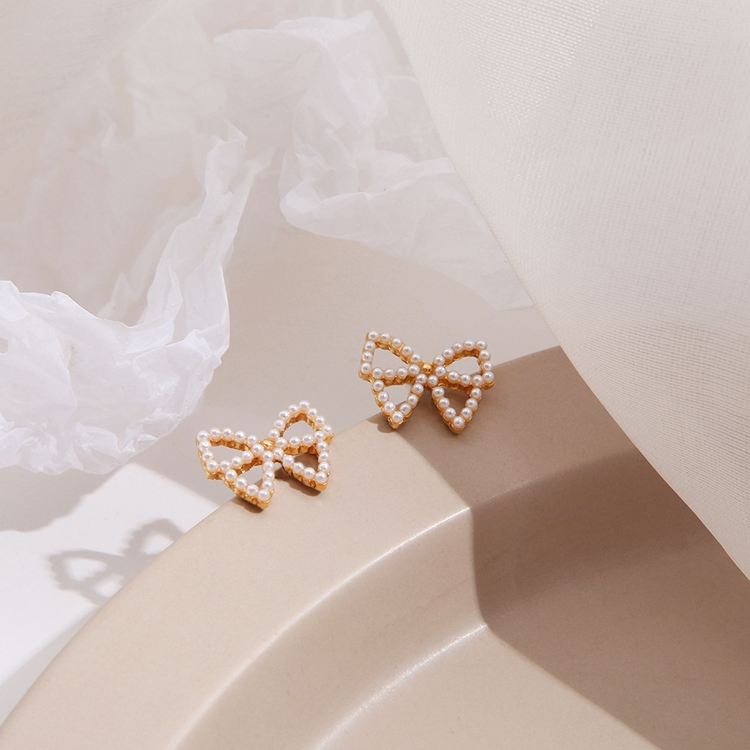 Bowknot Hollow Mystic Stud Earrings